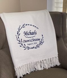 a personalized throw blanket on a couch