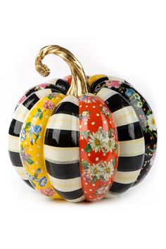 three decorative glass pumpkins sitting on top of each other