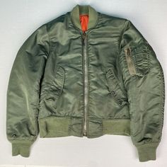 Military Flyer's Men Size 34 Jacket Green Intermediate MA-1 Nylon 1018-695-1620 Military Style Solid Color Windbreaker For Fall, Military Style Windbreaker For Fall, Green Nylon Outerwear For Streetwear, Military Style Solid Color Nylon Outerwear, Military Style Nylon Outerwear, Military Style Nylon Khaki Outerwear, Military Style Long Sleeve Outerwear With Zip Fly, Nylon Techwear Outerwear With Zip Fly, Nylon Sport Coat For Fall Streetwear