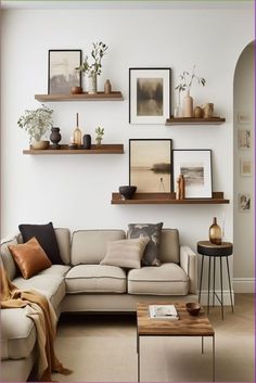 a living room filled with lots of furniture and pictures on the wall above it's couch