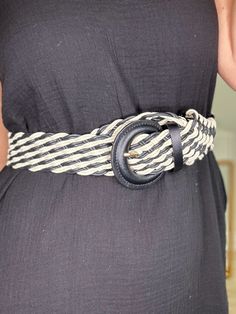 Just can't go wrong with black and white, especially with this two tone braided belt. It makes the perfect accent to your next outfit or maxi dress. It features a braided design and a partial circle buckle style. Details braided design black and white length 44" width 1.75" 100% polyester Chic Woven Belts For Beach, Chic Woven Belts For The Beach, Chic Woven Belt For Beach, Chic Adjustable Rope Belt, Chic Belts For Spring Vacation, Black Fabric Belt For Summer, Casual Black Belt For Summer, Chic Summer Vacation Belt, Casual Rope Belt For Vacation