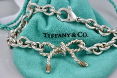 Tiffany & Co. 14K Gold & Silver Twist Ribbon Bow 8" Bracelet CUSTOMIZED (Originally a Brooch, Turned into a Bracelet using Tiffany Links & Clasp) 100% Authentic Tiffany Components were used to make Bracelet Polished and Cleaned to Look New! Hallmark: Tiffany & Co. STER 14KT Comes with Tiffany Pouch 30 Day Returns accepted! Make Bracelet, Twisted Ribbons, Bow Bracelet, A Bracelet, Fine Jewelry Bracelets, Ribbon Bow, Tiffany Heart, Heart Charm Bracelet, Ribbon Bows