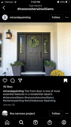 the front door is decorated with flowers and potted plants