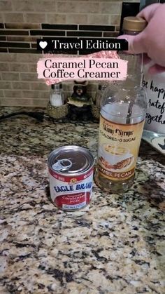 a can of coffee creamer next to a bottle of coffee creamer on a counter