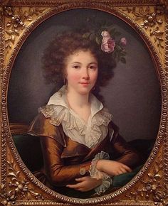 a portrait of a woman with curly hair in a gold frame, holding her hand on her chest