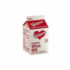 a carton of vitamin d'whole milk on a white background with the label