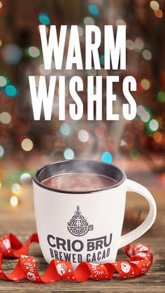 a cup of hot chocolate sitting on top of a wooden table