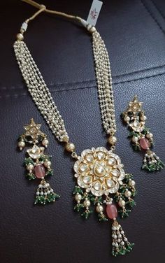 *Gold Plated Indian Kundan Jewelry Necklace and Earrings. *It's 22 K Gold Plated made from Silver and Copper Mix material and also using handcut stones like shown in picture. *It's beautiful Ethnic Indian Wedding Pendant Necklace with Statement Earrings*It's Earrings are 2.5 Inch Long. *Necklace and Earrings are same like shown in picture. *It will come with adjustable string which fits all Neck size and Can adjust necklace Length.Its 8 Inch long Pearl Stringing and can be adjust up to 12 inches Luxury Gift Bridal Necklace With Latkans, Traditional Wedding Jewelry Sets With Gota Work, Kundan Jewelry Set With Gota Work For Wedding, Wedding Temple Jewelry Sets With Gota Work, Traditional Kundan Jewelry Sets For Reception, Traditional Necklace With Gota Work For Receptions, Long Gold Pendant Necklace, Pakistani Wedding Jewelry, Kundan Mala