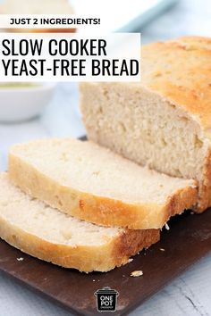 sliced loaf of bread sitting on top of a cutting board with text overlay that reads just 2 ingredients slow cooker yeast - free bread