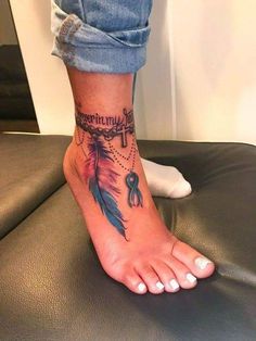 a woman's foot with a tattoo on it