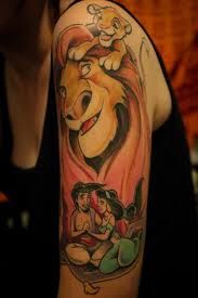 a woman with a lion tattoo on her arm