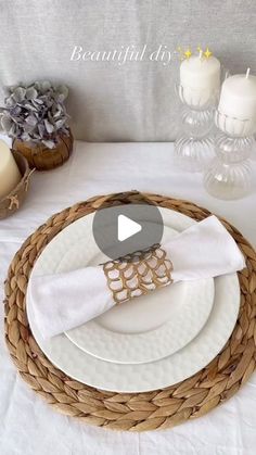 a table setting with white plates and silverware