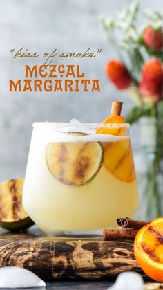 a margarita with orange slices and cinnamon on the rim