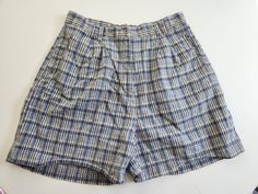 These vintage shorts are perfect for summer days. L.A. Blues Circa 1990s - 2000s 55% ramie / 45% cotton Made in Hong Kong The shorts feature a blue plaid pattern. There are belt loops, a zipper fly, and three pockets. Tag size: 16 Total length: 18.75 inches Waist: 32 inches Hips: up to 47 inches Inseam: 5.25 inches These shorts are in good vintage condition with minor wear. Feel free to send me any questions! 90s Style Cotton Summer Pants, 90s High Waist Pants For Summer, 90s High Waist Summer Pants, High Waist 90s Style Pants For Summer, Blue Jean Shorts For Summer With Short Inseam, Blue Jean Shorts With Short Inseam For Summer, 90s Style Bottoms With Built-in Shorts, Fitted 90s Blue Shorts, High Waist Blue Bermuda Shorts For Summer