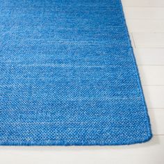 a blue rug is laying on the floor