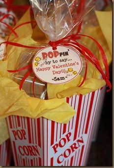 two popcorn boxes wrapped in red and yellow paper