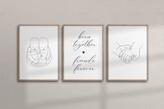 three framed art prints with handwritten words on them, hanging on a wall in a living room