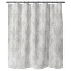 a shower curtain with white flowers on it