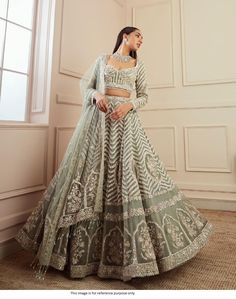 Bollywood Replica LehengaBollywood Model Grey embroidered designer lehenga choliGeorgette lehenga with heavy sequence, dori & zari work in Flair 3 meter and Cancan attach in semi stitch. Georgette blouse + net sleeves with heavy sequence, dori & zari work all over front & back ( Unstich ) and the tassels border given.Net Dupatta with heavy sequins, Dori & zari work + tassels border attach Shipping time is 5-7 days.Buy this Lehenga at Kollybollyethnics and make your occa Green Lehenga Choli, Lehenga Bridesmaid, Blouse Lehenga, Lehenga Choli Designs, Indian Wedding Lehenga, Bridesmaid Lehenga, Indian Lehenga Choli, Lehenga Choli Wedding, Party Wear Lehenga Choli