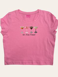 Want to show your love of martinis to the world in a cute coquette baby tee? Well here is your chance. Our It's Tini Time! baby tee is adorned with a cute little bow and is embroidered on a 95% cotton/5% spandex crop top for a form-fitting fit. Available in multiple colors! Sizes run small so please check the sizing chart and order accordingly. Fitted Pink Top With Funny Print, Cute Party Top With Crew Neck, Cute Crew Neck Top For Party, Cute Fitted T-shirt For Party, Cute Fitted Party T-shirt, Cute Short Sleeve Party Tops, Cute Party Top With Funny Print, Cute Tops With Funny Print For Party, Spandex Crop Top