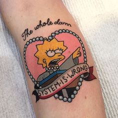 a person with a tattoo on their arm that says, the whole damn system is wrong