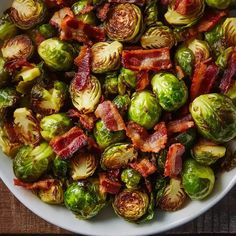 bacon and brussel sprouts in a white bowl on a wooden table