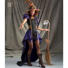 a woman dressed as a witch holding a broom