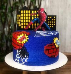 a spiderman themed cake on a plate