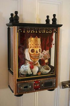 an old fashioned slot machine with a skull on it's face and the words fortunes