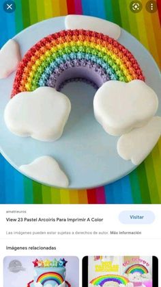 a rainbow cake with white icing on a plate