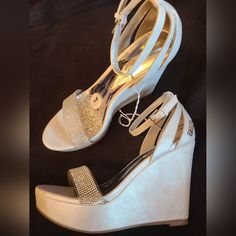 Nwot Sugar Size 7 Cream Platform Wedge Sparkling Rhinestone Strap Across Foot Strap With Buckle Fastening Around Ankle For Secure Fit Open Toe Sugar Logo Tag On Side Towards Back Top Part Of Wedge 4½In Height Of Wedge In Back 3in Height Of Wedge At Front Logo Tag, Platform Wedge, Womens Shoes Wedges, Platform Wedges, Open Toe, Wedges, Size 7, Buckle, Women Shoes