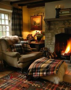 a living room filled with furniture and a fire place