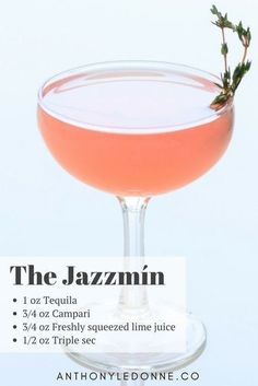 the jazzmin cocktail is served in a coupe glass with a sprig of rosemary