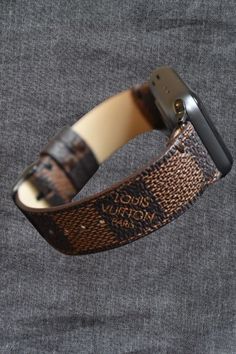 100% Handmade Apple ®  Watch Band Damier LV Monogram Brown - Made to Order. , that's been cut, sewn, and turn into a watch strap from pre-purchased/pre-owned and up-cycled L.V. cover material and make the watch bands. Includes new Apple Watch stainless steel hardware in gold, rose, silver, black and size of 38mm, 40mm/41mm, 42mm, 44mm/45mm.  Please note that we offer different hardware size options for the Series 7 and Series 8 Apple  watch. To ensure a proper fit, the Series 7 & 8 hardware s Luxury Brown Watch With Bracelet Strap, Luxury Black Watch Bands, Luxury Brown Adjustable Watch, Brown Watch With Bracelet Strap And Round Dial, Brown Watch Bracelet Strap With Round Dial, Luxury Black Apple Watch Band, Luxury Brown Watch Accessories With Bracelet Strap, Luxury Rectangular Black Band Watch Accessories, Designer Adjustable Watch Bands As Gift