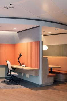 an office cubicle with two desks and chairs