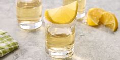 two glasses filled with water and lemon slices