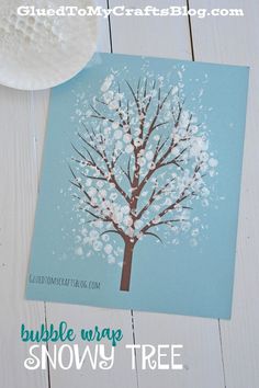 a card with a tree on it and the words bubble wrap snowy tree next to it