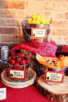 a table topped with baskets filled with fruit