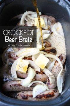 a crock pot filled with meat and onions being poured into the slow cooker