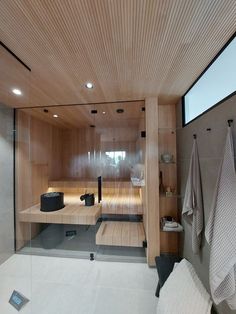 there is a bathroom with wooden walls and flooring