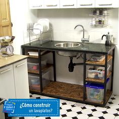 a kitchen with a sink and shelves in it