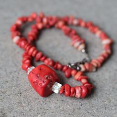 Vintage Natural Red Coral Necklace With Cut Aurora Borealis Crystal Beads. Great Piece With A Deep Red Color. This Is The Color That This Coral Has In Nature And It Is Not Dyed Therefore There Are Some Variations In The Beads Coloring And Texture. Beautiful Iridescent Cut Crystal Bead Accent. The Decorated Silver Hook And Eye Closure Is A Nice Touch. -Raw Coral -Silver Closure -Made In The 1960s Measurements: 18" Mentionable Imperfections: None Stock #: 0000 Elegant Red Beaded Necklace With Lobster Clasp, Red Rondelle Jewelry With Natural Stones, Red Beaded Necklaces With Natural Stones For Gift, Red Rondelle Jewelry For Gifts, Red Rondelle Jewelry With Faceted Beads, Red Rondelle Beads Jewelry With Faceted Detail, Handmade Red Rondelle Jewelry, Coral Faceted Beads Jewelry As Gift, Coral Faceted Beads Jewelry For Gifts