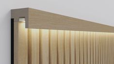 a close up of a light on the side of a wooden wall with vertical slats