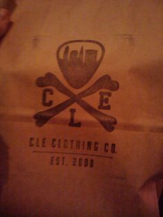 a brown paper bag with a skull and crossbones on the front that says cleaching co est 2009