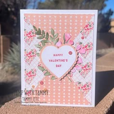 a handmade valentine's day card sitting on a ledge