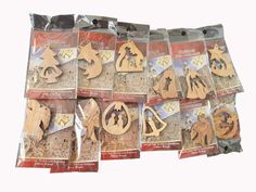 wooden cutouts are displayed in bags on a white background