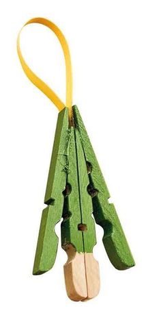 an ornament made out of popsicle sticks with a yellow ribbon hanging from it