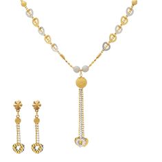 Adorn yourself with opulent beauty with this 22k gold necklace and earring set by Virani Jewelers. Meticulously crafted beading, draped in the brilliance of 22k yellow and white gold, creates a 22k gold jewelry set that softly graces your neckline and ears. This fine gold jewelry set is a subtle yet powerful statement, a Virani Jewelers creation that reflects our dedication to blending quality craftsmanship with contemporary elegance. Features • 22k yellow gold • 22k white gold • Heart shaped de Elegant Dual-tone Yellow Jewelry, Elegant Yellow Dual-tone Jewelry, Elegant 22k Gold Dual-tone Jewelry, Elegant White 22k Gold Jewelry Sets, Elegant Dual-tone Yellow Gold Necklace, Beaded Heart Necklace, Gold Jewelry Set, 22k Gold Necklace, Beaded Heart