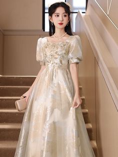 Elegant Embroidered Prom Ball Gown, Embroidered Floor-length Ball Gown For Party, Embroidered Ball Gown For Party, Gold Fitted Ball Gown For Party, Gold Ball Gown For Party, Glamorous Gold Organza Dress, Gold Embellished Dress For Prom Season, Gold Floor-length Ball Gown For Party, Festive Ball Gown For Banquet