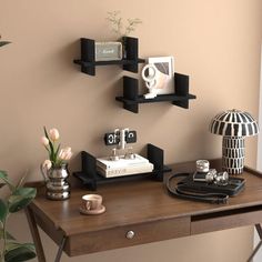 a wooden desk topped with two black shelves